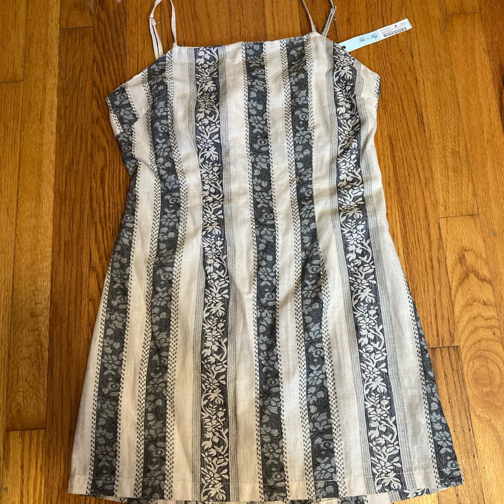 She and sky, large striped floral dress